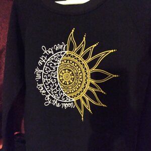 black celestial themed sweater